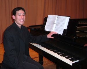 Dr. Gerald Lee at piano