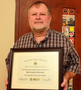 Professor David Thomas is shown here with the grant award.