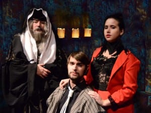 Judas, played by Jed Shook of Wheeling, is shown with Alex Franke, Wheeling, as Caiaphas (left) and Maggie Dillon, Elwood City, Pa. as Satan.