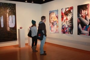 Sara Reed, New Manchester, W.Va. and Jaccob Trifonoff, Steubenville, Ohio, enjoy the Senior Art Exhibition in Nutting Gallery.