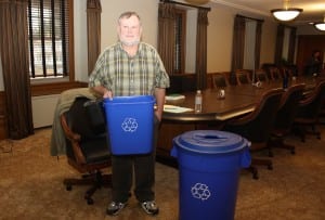 Dave Thomas is shown in Shaw Hall  with the new blue recycling bins.