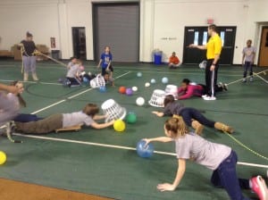 WLU/ student Zach Winland leads students in a human "Hungry Hungry Hippos" game. 