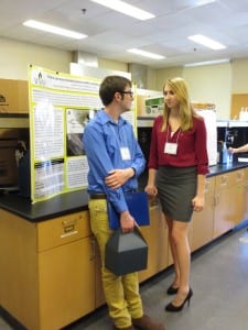 Science majors, Eric Tennant and Leah Cyrus are shown with their research.