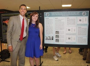 Dr. Matt Zdilla congratulates Kennedy McLean on her research poster that summarizes her summer work in the anatomy lab.