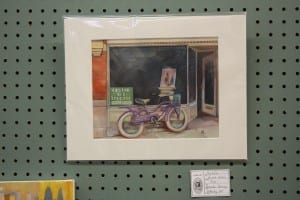 Amanda Carney's pleine air painting of her bike and shop.