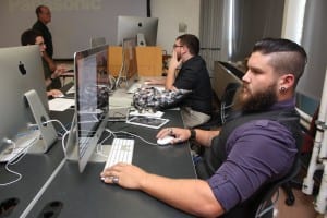 Josh Verhovec works on his Mac in graphic design 3 class. 