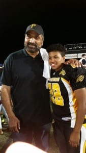 Rosie wears is shown with Steeler football legend and Pittsburgh Passion owner Franco Harris.