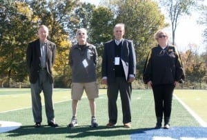 From left, Interim President  Dr. John McCullough greets Wall of Honor alumni, TC Cervone, Mike Pockl and Kris Williams.