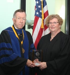 Kris Williams is shown with Interim President Dr. John McCullough at last spring commencement.