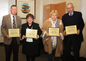 From left, Dr. John P. McCulough, Dr. Judy Stechly, Sue Baker and Jack Wright display their awards.