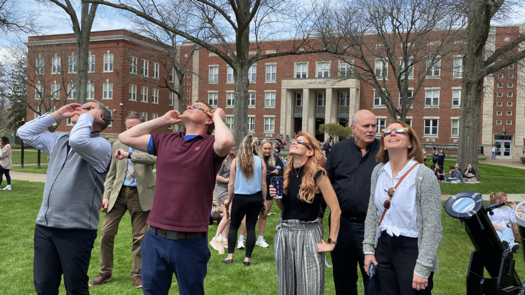 Faculty and Staff looking at Eclipse